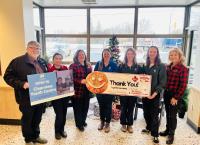 Mayor Doug Measures, Clearview Youth Centre Coordinator Courtney Rogers and Youth Centre Assistants Carson Arrigo and Felicia Wells accepting the Tim Hortons Holiday Smile Cookie Week donation from Amy Bennett and Ann Murphy